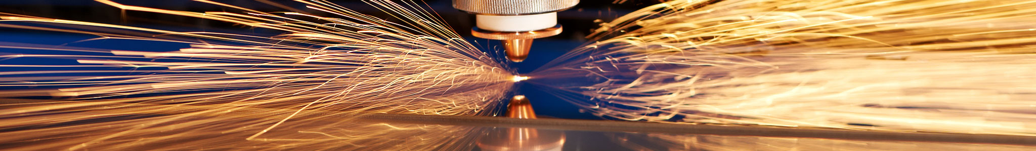 Image of laser cutting metal with sparks